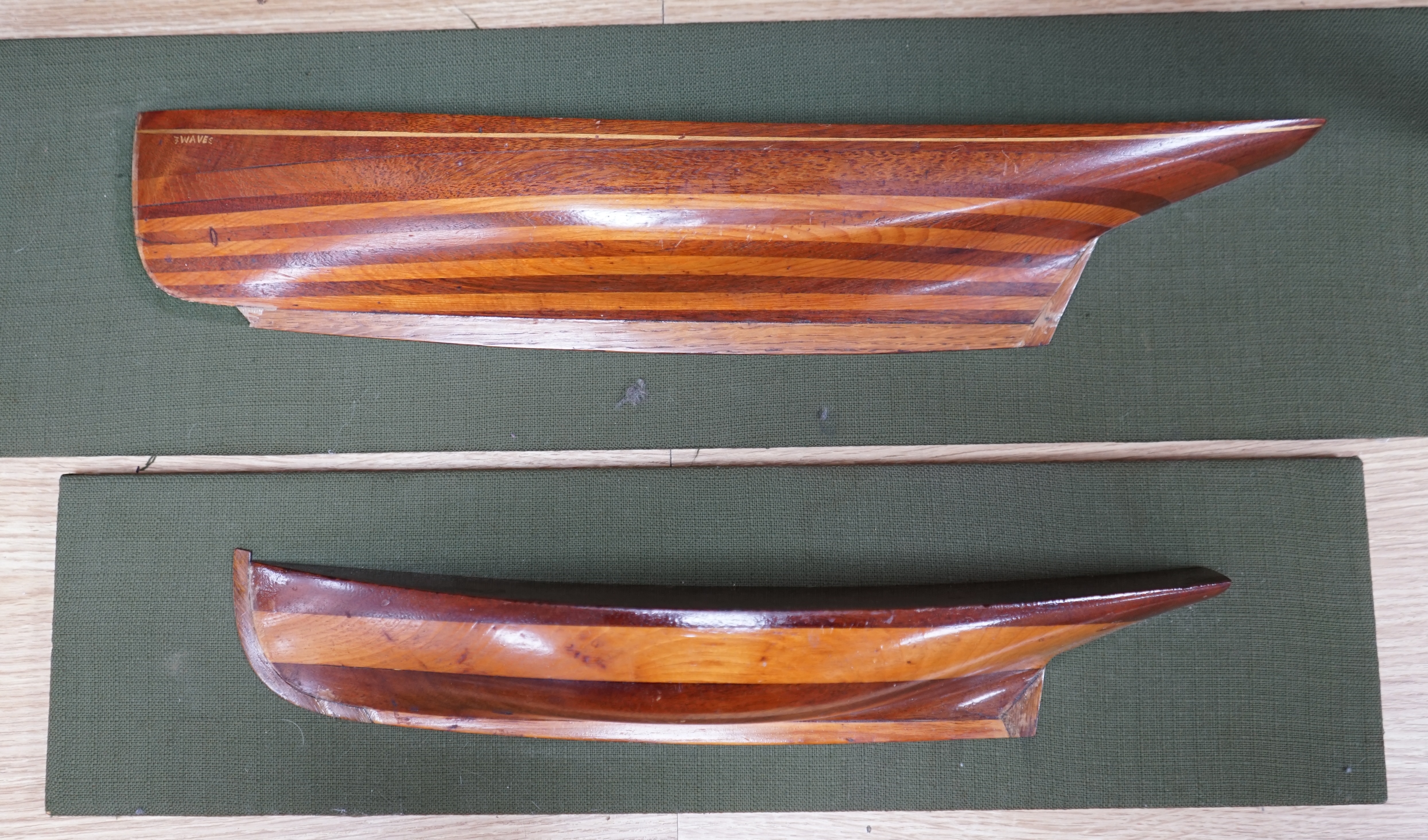 Two mounted cross banded mahogany and yew wood split hull models. Condition - fair to good